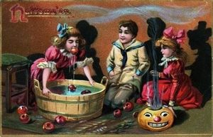 A halloween scene with children bobbing for apples is printed on this Tuck postcard from early 20th century published in London, England. (Photo by Transcendental Graphics/Getty Images)